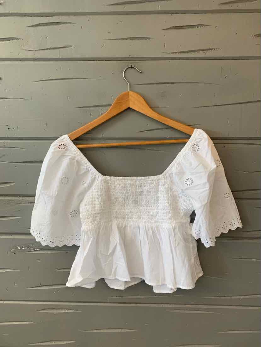 White off-shoulder eyelet blouse with puff sleeves and smocked bodice, size XS.