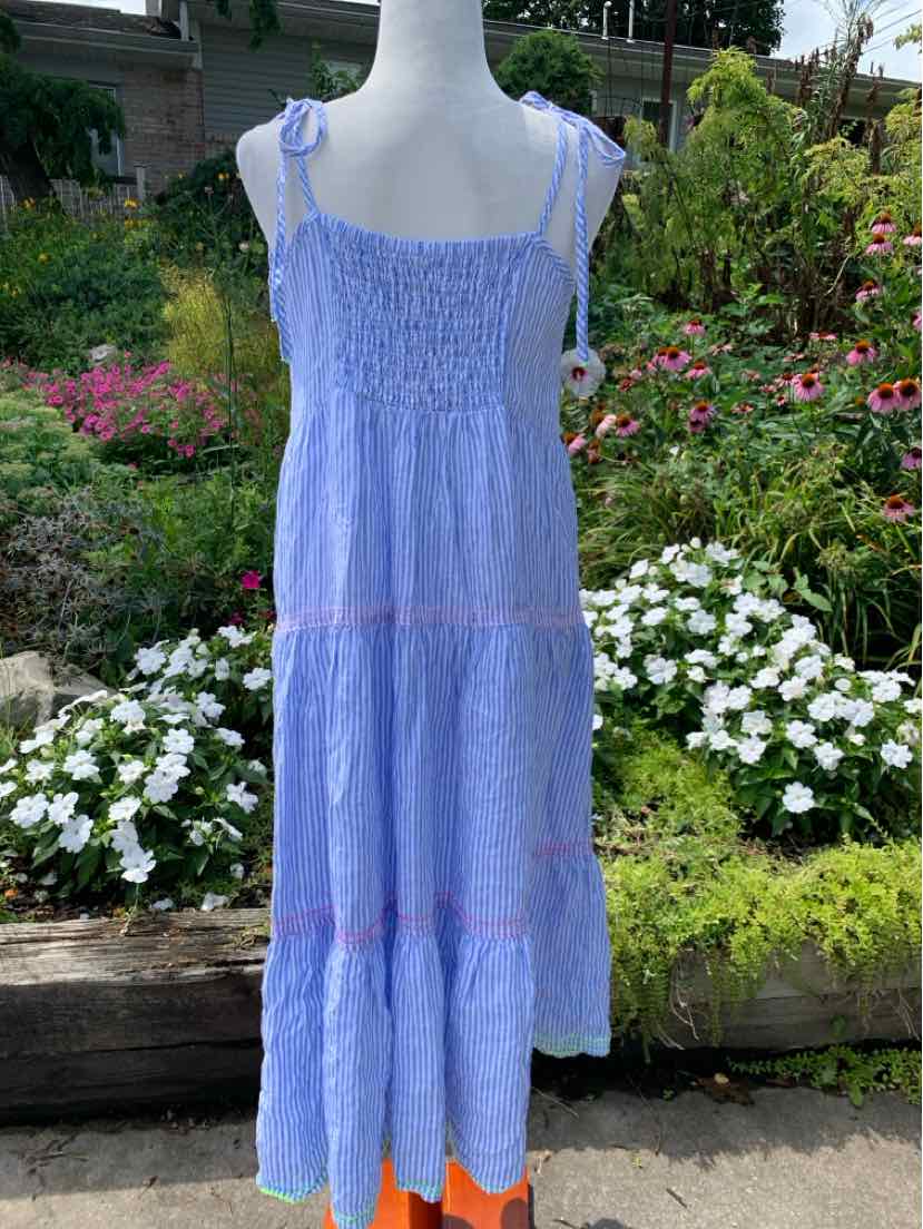 Light blue sleeveless sundress with thin straps and tiered skirt featuring subtle horizontal stripes.
