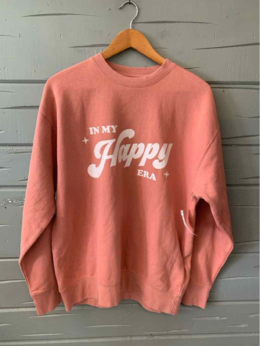 Dusty pink oversized sweatshirt with white "In My Happy Place" text and crew neck design.