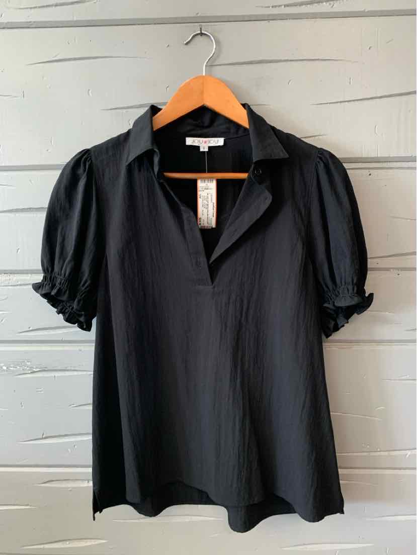 Black short-sleeve blouse with puffed sleeves and a V-neck collar on wooden hanger.