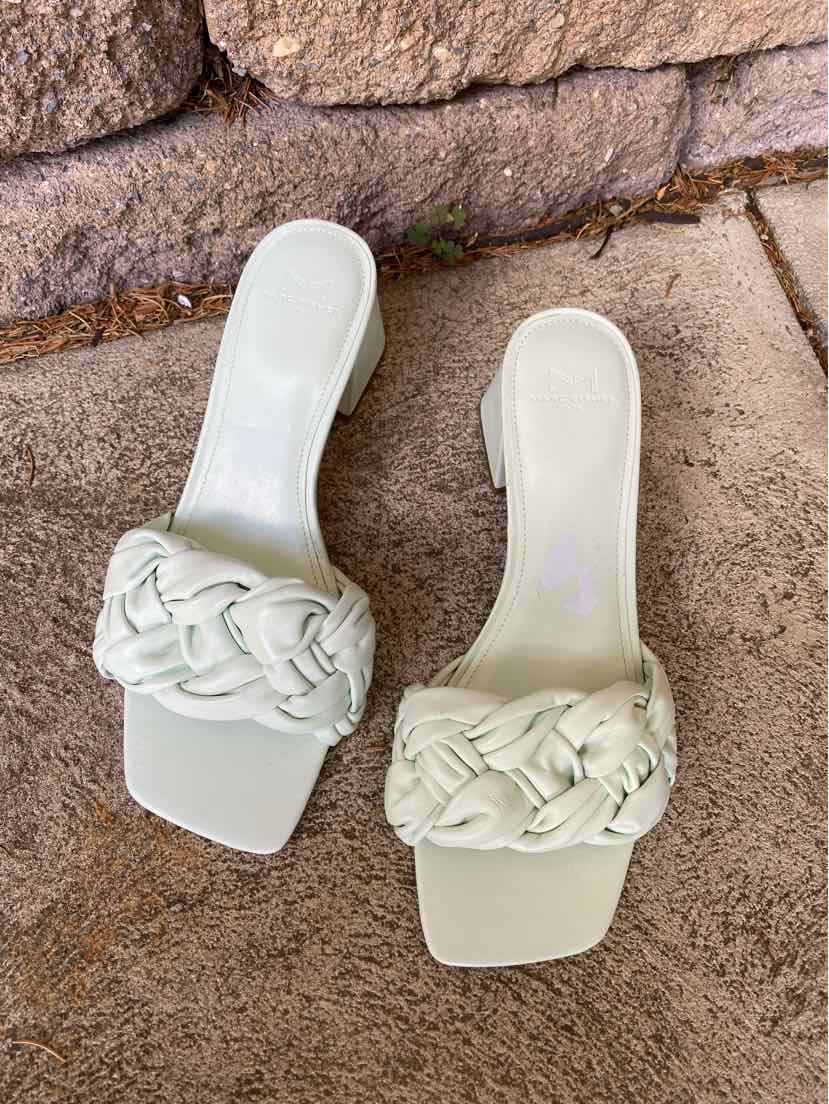White slide sandals with wide braided leather straps and square toes, size 9.