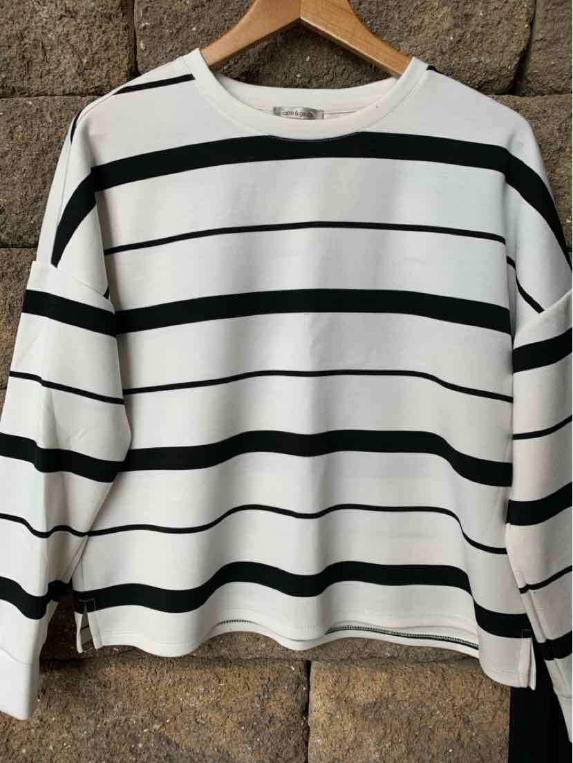 White long-sleeve shirt with black horizontal stripes, crew neck, and relaxed fit.
