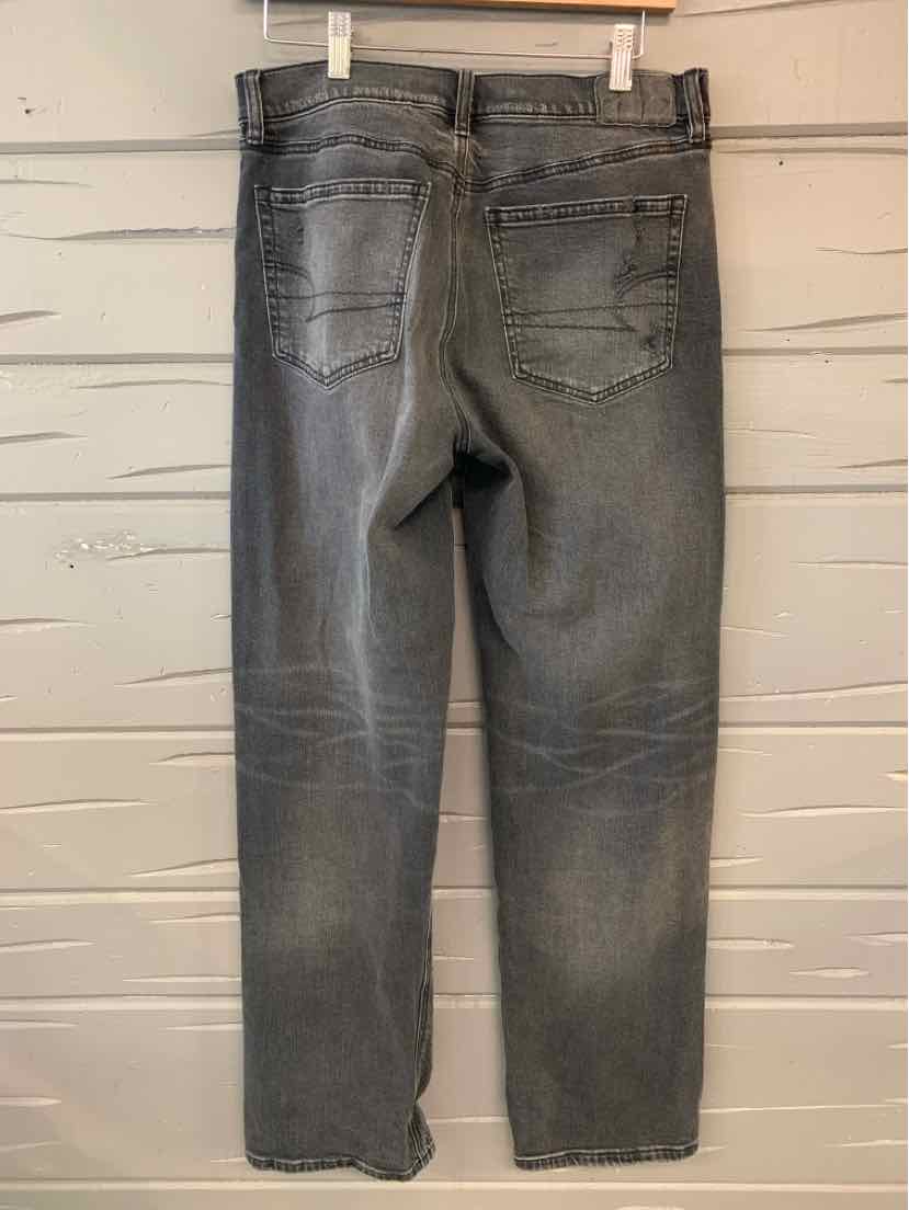 Women's black American Eagle jeans size 4 with faded wash and back pockets.