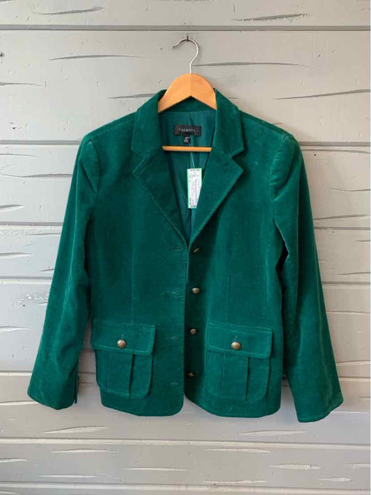 Emerald green velvet blazer with notched collar, gold buttons, and front flap pockets.