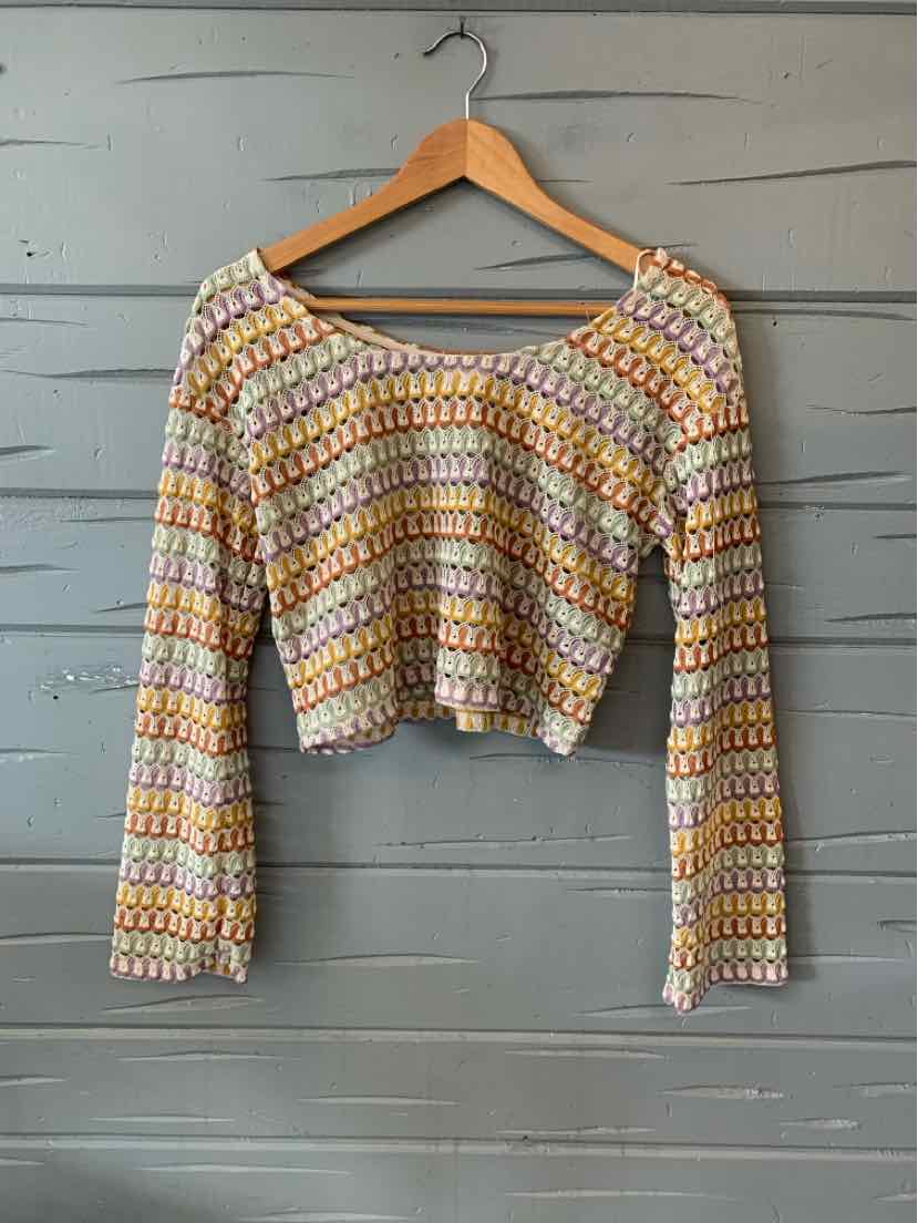 Multi-colored crochet long-sleeve crop top with scoop neckline and scalloped edges.