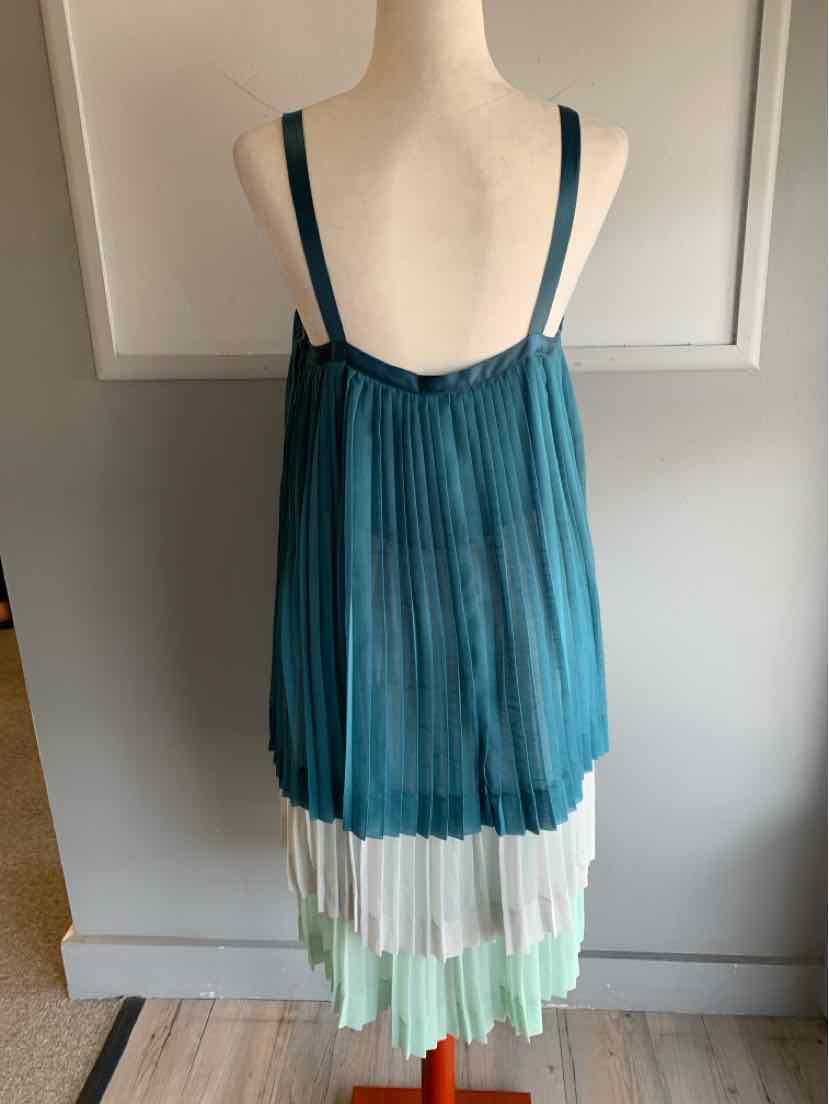 Teal sleeveless pleated dress with tiered white and mint green hem, size 10.
