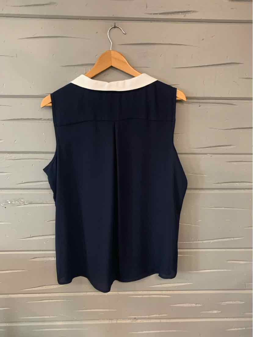 Navy blue sleeveless top with white collar, relaxed fit in size XL hanging on wooden hanger.