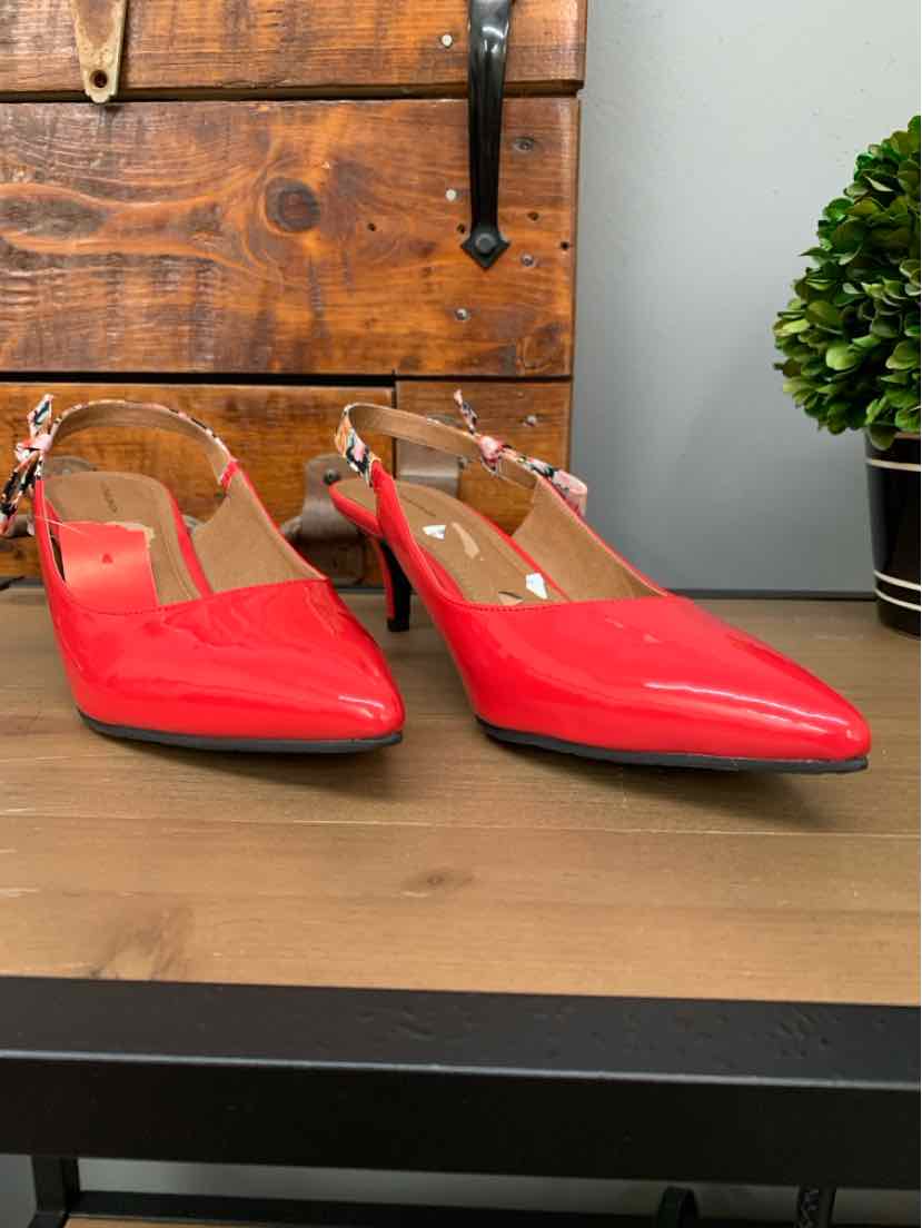 Red patent leather pointed-toe slingback heels with adjustable ankle straps, size 9.