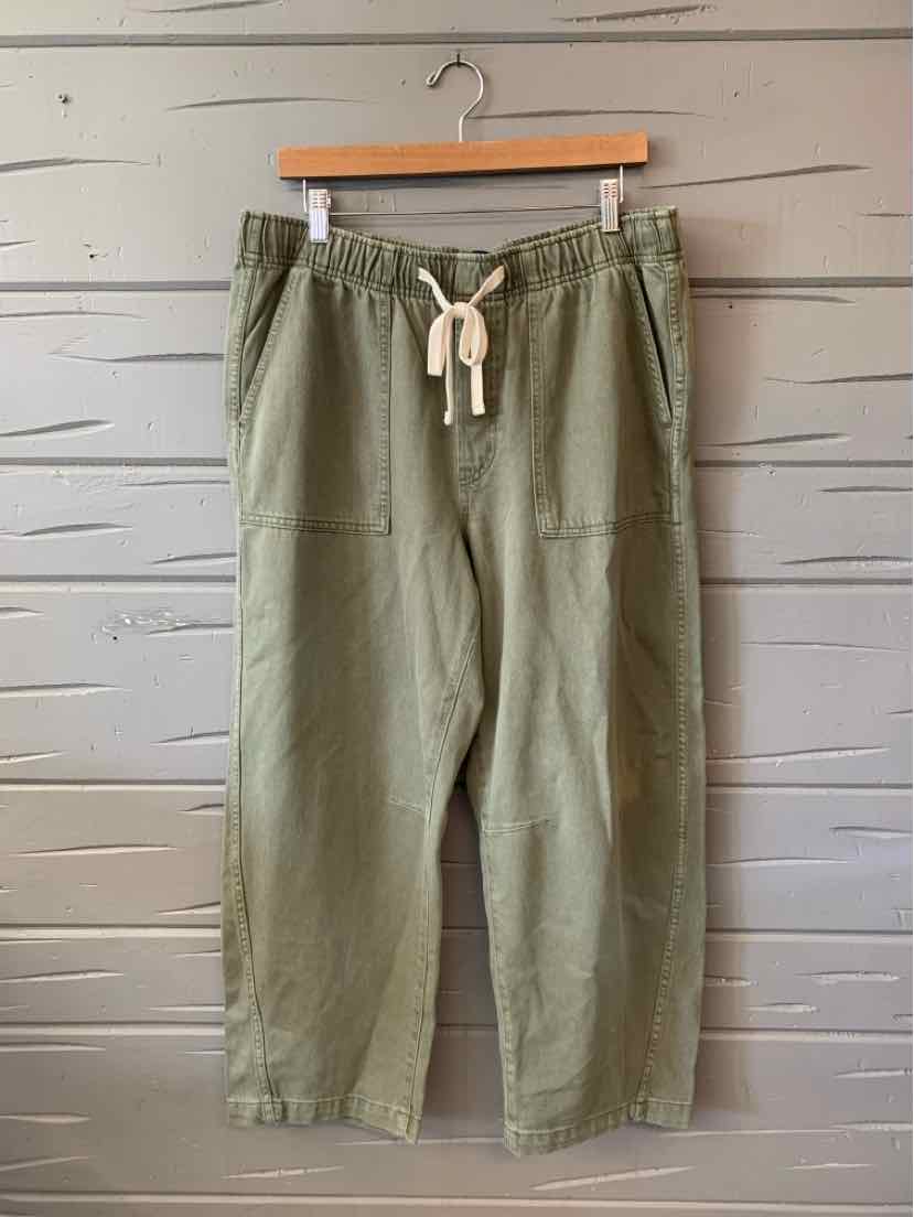 Olive green casual pants with drawstring waist and elastic cuffs, relaxed fit, lightweight fabric.