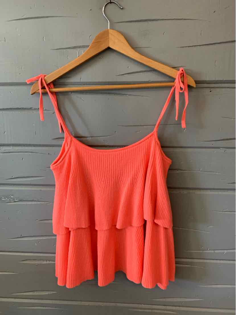 Coral knit sleeveless top with double layered ruffles and adjustable tie straps.