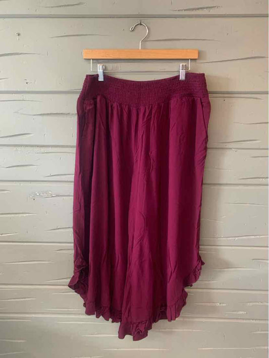 Deep magenta wide-leg pants with elastic waistband and ruffled hem, size 18-20.