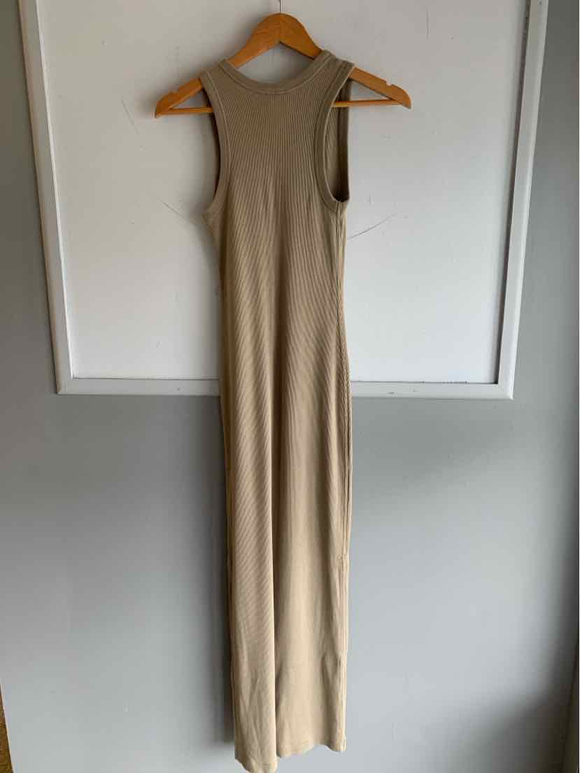 Sleeveless tan ribbed knit maxi dress with high neck and slim fit silhouette.