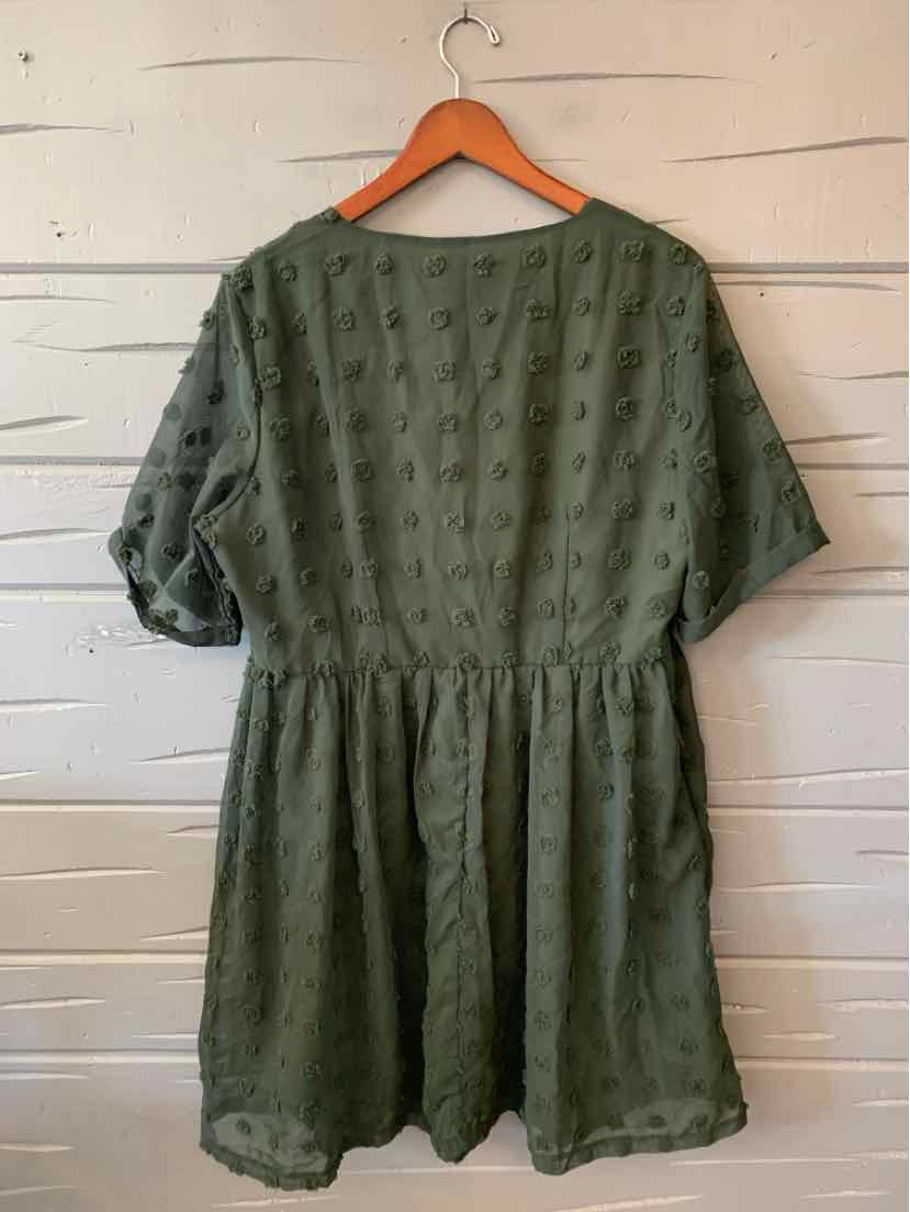 Olive green Grace Karin short-sleeve dress with a textured dotted pattern, gathered waist, and loose skirt on a hanger.