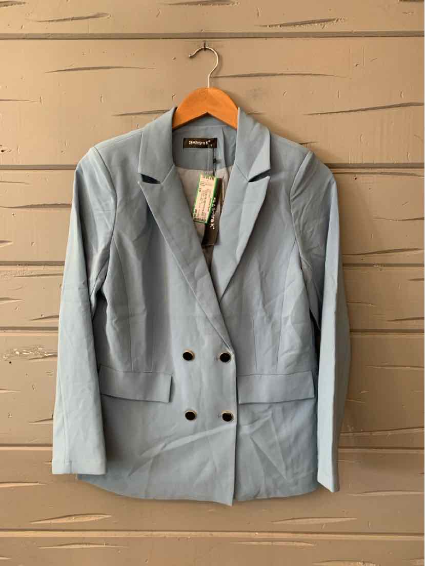 Light blue double-breasted blazer with notch lapels and front flap pockets on wooden hanger.