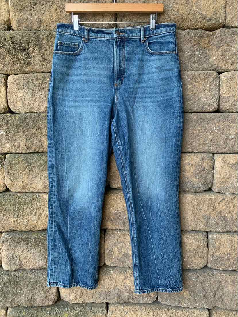 Blue denim jeans with rivet detailing, straight-leg cut, and classic five-pocket design.