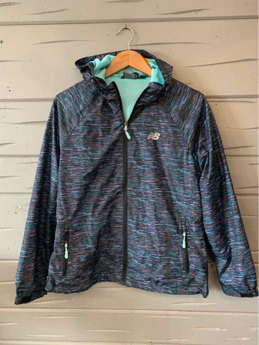 Women's New Balance lightweight hooded jacket in dark multi-color pattern with zip pockets and teal lining.