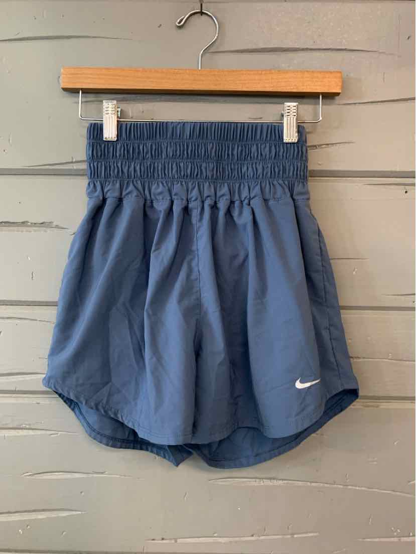 Navy blue lightweight Nike shorts with elastic waistband and small white swoosh logo on hem.