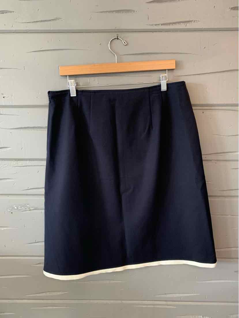 Black knee-length skirt with white trim at hem, straight cut, made of smooth fabric.