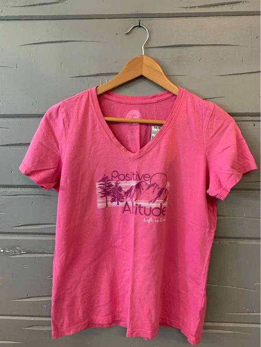 Pink short-sleeve V-neck T-shirt with "Life is Good" graphic and floral design on front.