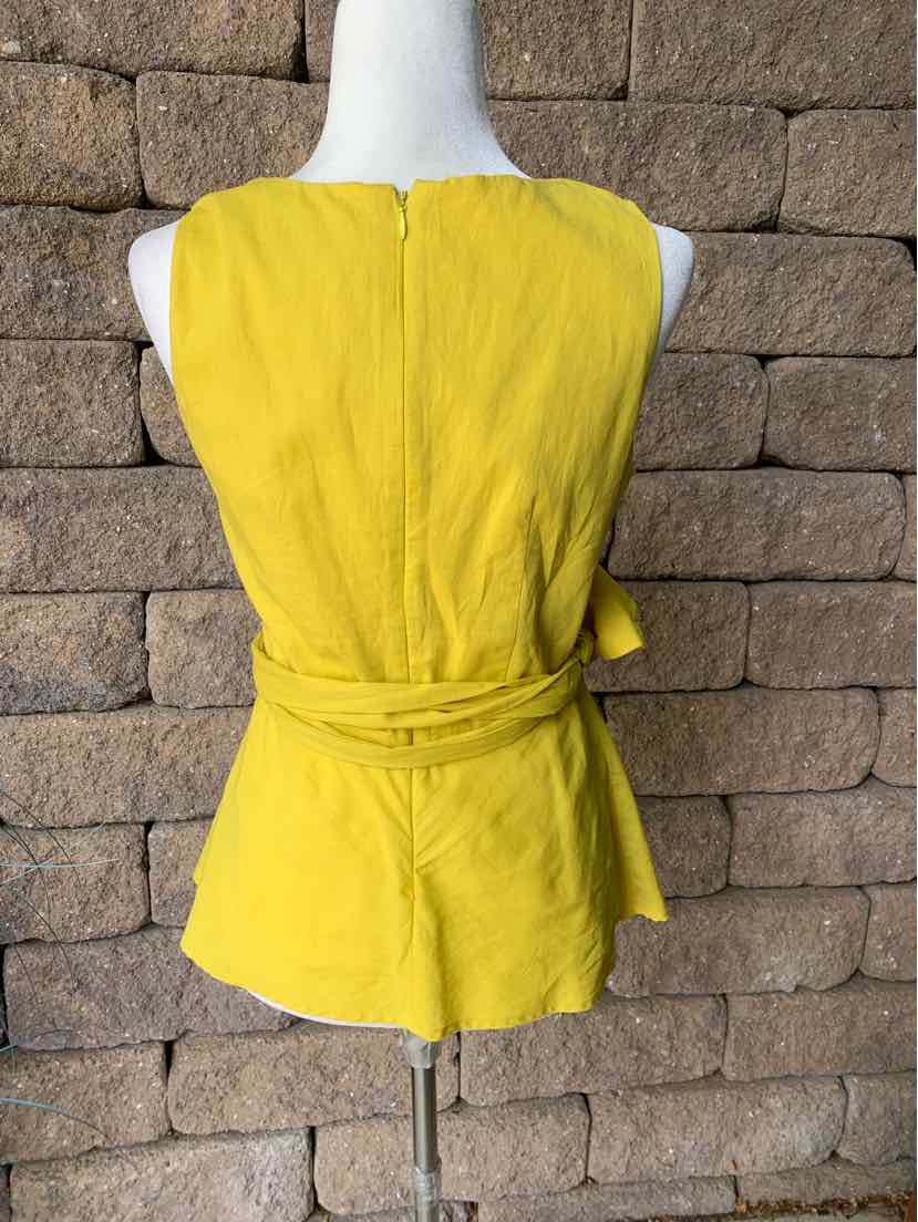 Yellow sleeveless blouse with a round neckline and a self-tie belt at the waist, made from a soft, lightweight fabric.