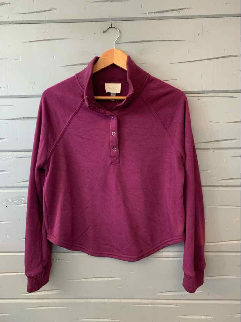 Women's burgundy long-sleeve pullover with a short button placket and collar.