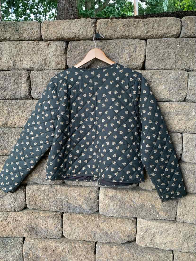 Gray quilted jacket with all-over floral print and long sleeves, size large.