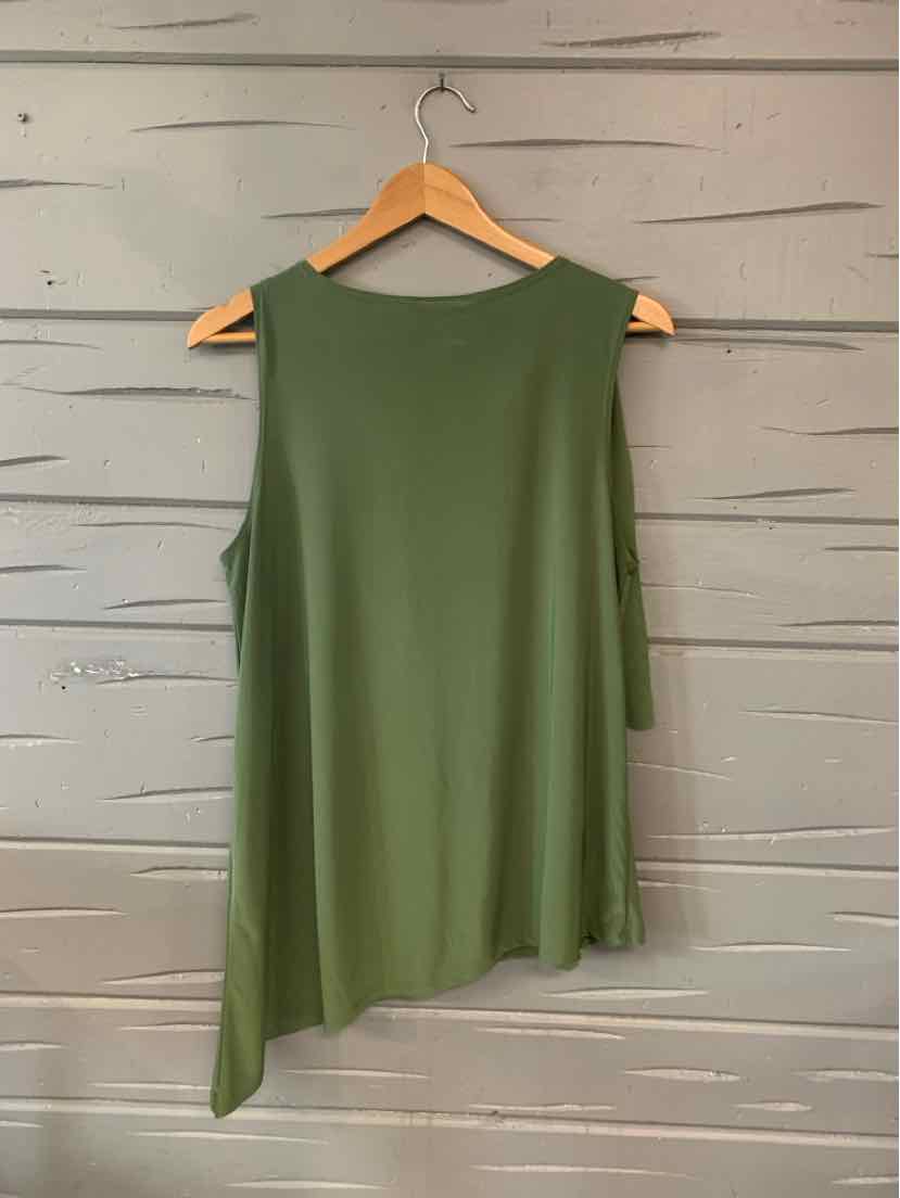 Asymmetrical olive green sleeveless top on wooden hanger against gray wooden wall.
