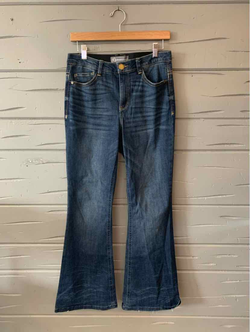 Blue denim bootcut jeans with front and back pockets, slight fading on thighs and knees, size 6P.