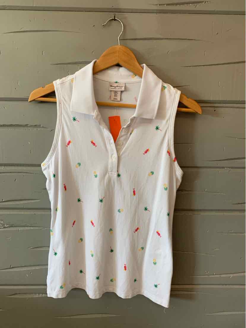 White sleeveless polo shirt with small multicolored tropical print, collar, and V-neck opening.