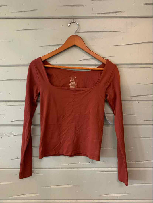 Burgundy long-sleeve casual top with scoop neckline, lightweight fabric for women's activewear apparel.