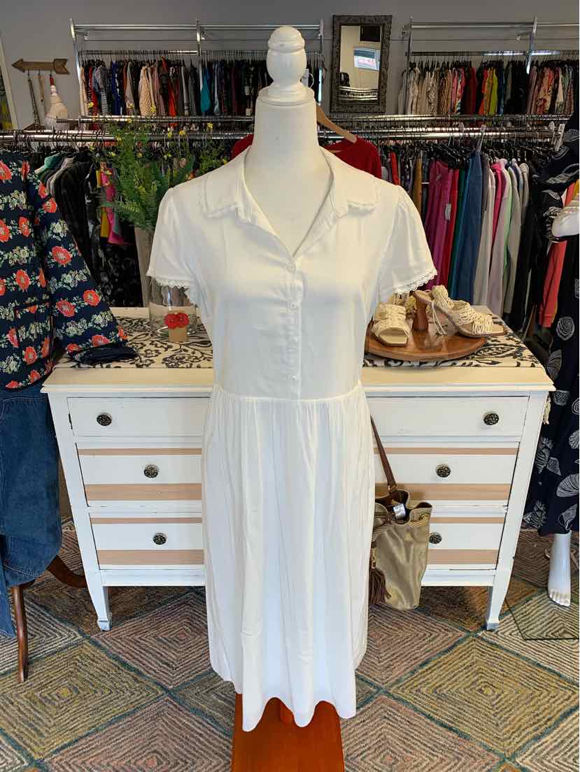 White short-sleeve button-up midi dress with collar and fitted waist on mannequin.