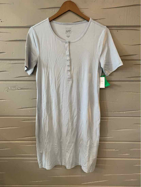 Light blue short-sleeve ribbed knit dress with button detail on front.