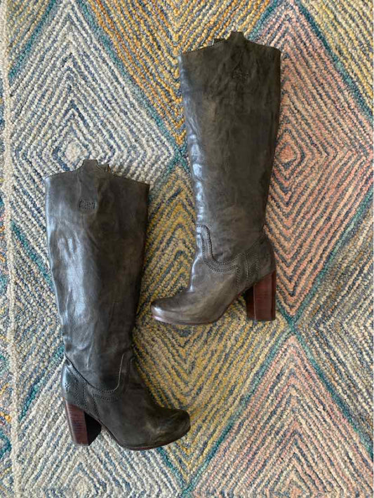 Dark gray leather knee-high boots with stacked wooden heels size 5.5 on patterned rug.