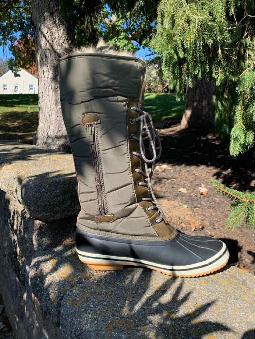 Tall taupe insulated winter boot with black rubber toe and sole, lace-up front, and side zipper.