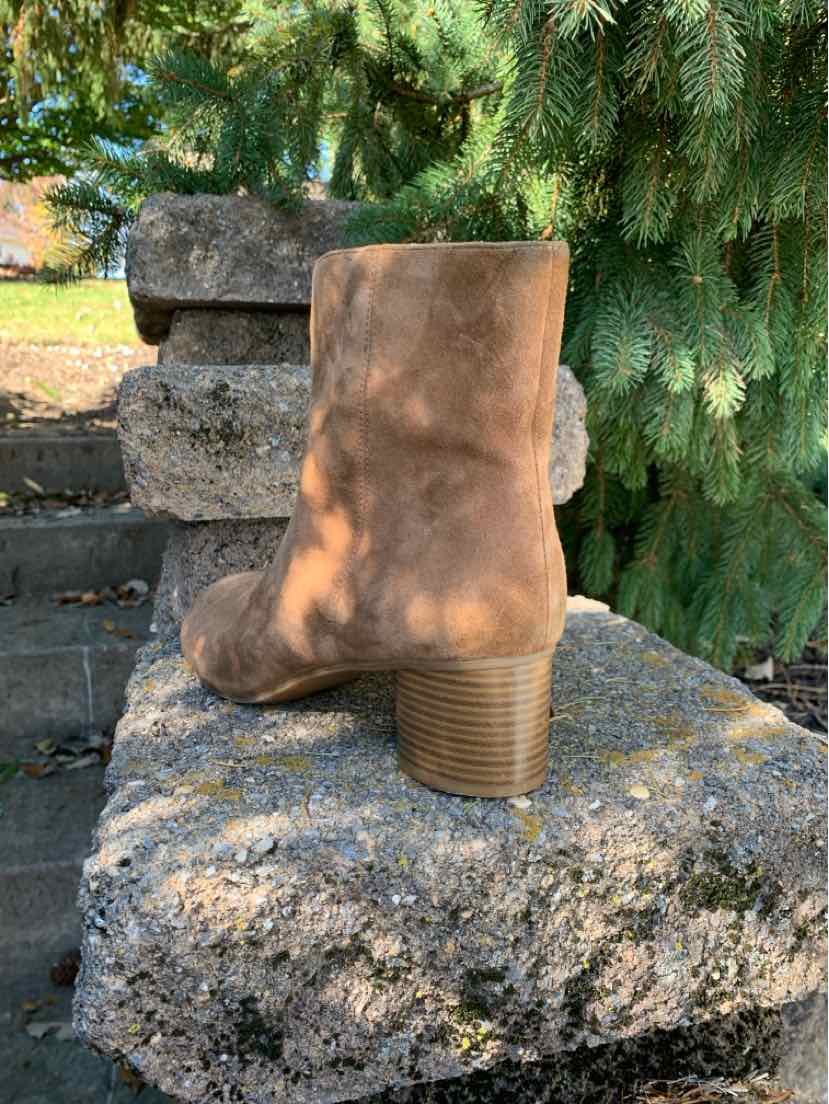 Brown suede ankle boot with a rounded toe and stacked block heel, shown from the side.
