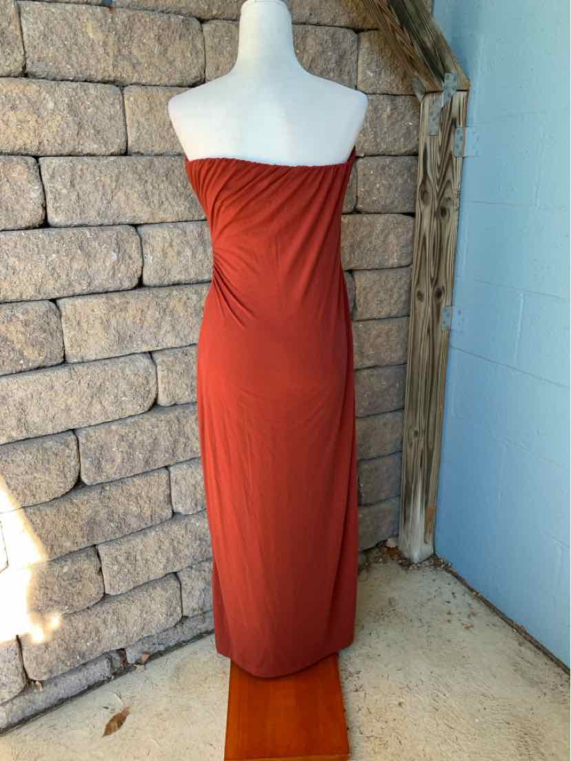 Women’s burgundy strapless maxi dress with a ruched bodice and fitted silhouette.