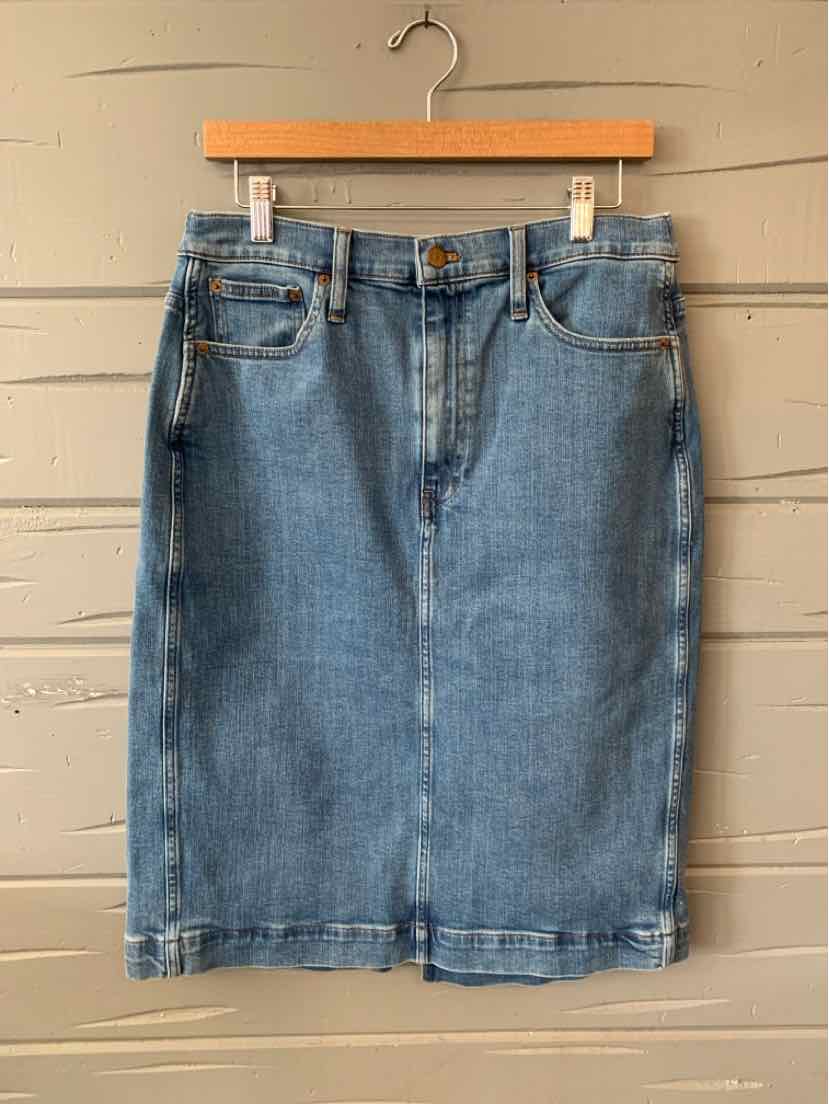 Mid-length blue denim skirt with front pockets and button closure, size 10.