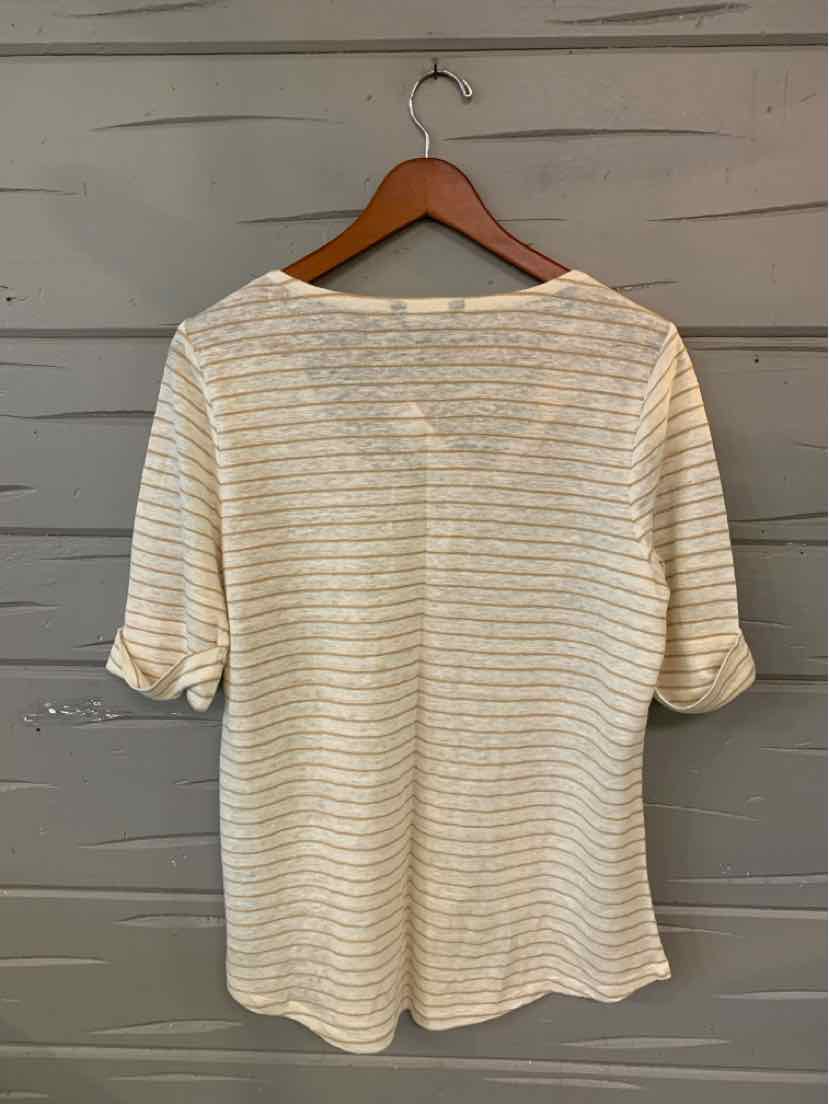 White long-sleeve top with thin horizontal gold stripes and a rounded neckline.