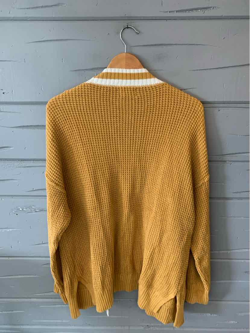 Yellow knit cardigan with white stripe on collar, oversized fit, and long sleeves.