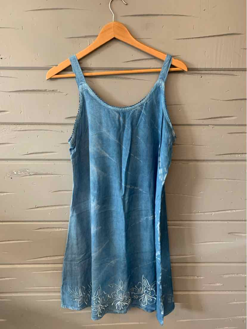 Blue sleeveless sun dress with thin straps and floral embroidery along the hem, made of lightweight fabric.