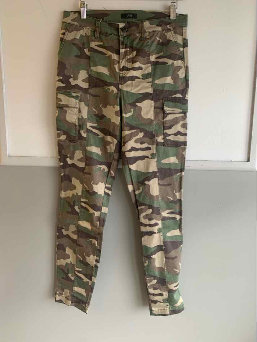 Kids' camo cargo pants in green and brown with multiple pockets and tapered legs.