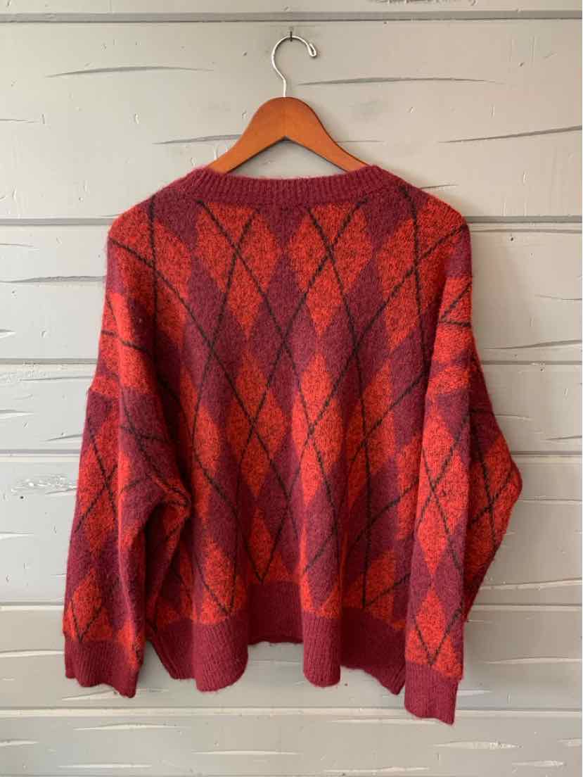 Red Vince Camuto sweater with a black argyle diamond pattern, long sleeves, and ribbed hem and cuffs.