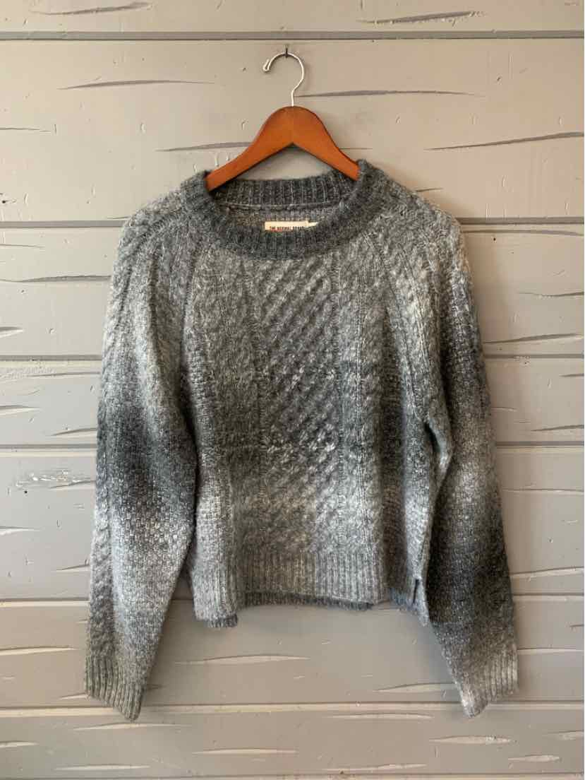 Gray marled knit women’s sweater with a crew neck, long sleeves, and a textured cable pattern.