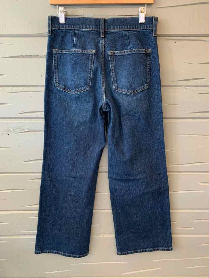 Dark blue straight-leg denim jeans with back patch pockets and subtle fading details.