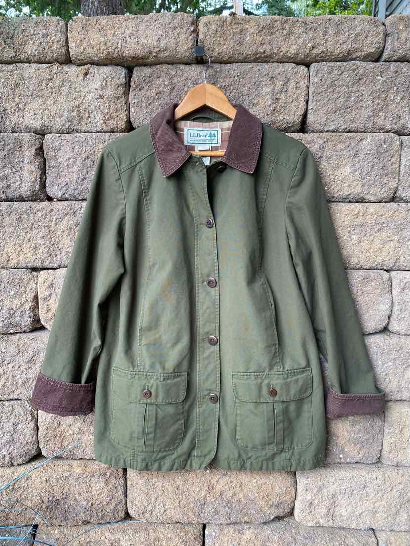 Olive green cotton jacket with brown corduroy collar and cuffs, button front, and flap pockets.