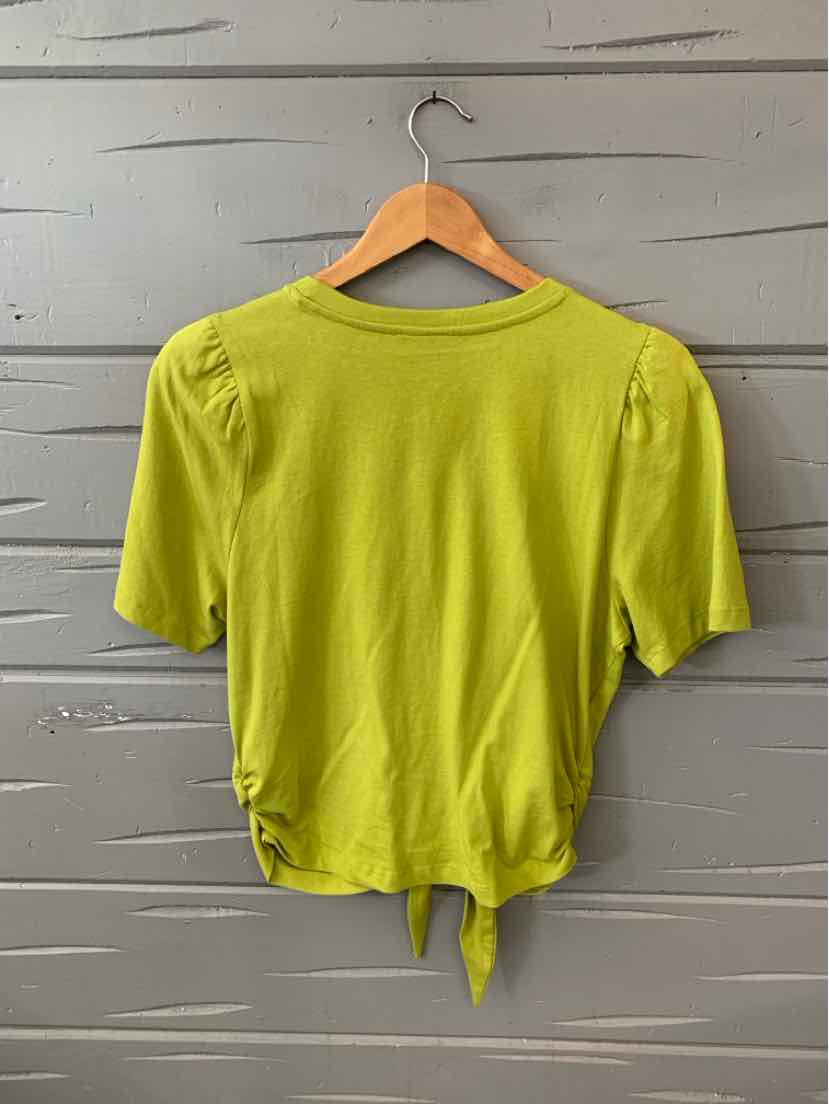 Light green short-sleeve top with puff shoulders and a tie detail at the waist.