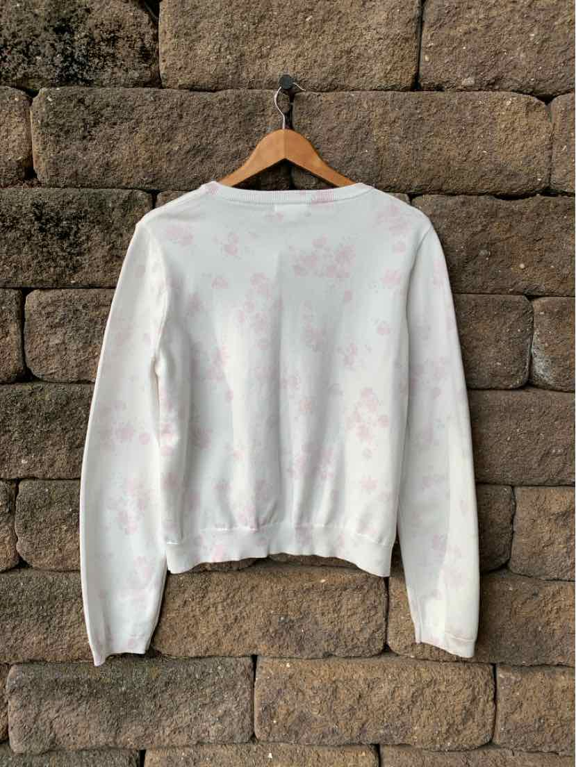 White Aeropostale crewneck sweatshirt with pale pink floral print, long sleeves, and ribbed cuffs and hem.