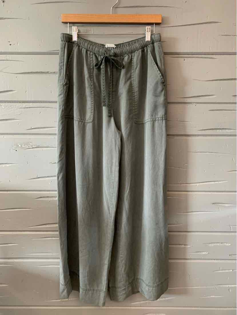 Light gray wide-leg pants with drawstring waist and patch pockets, casual relaxed fit.
