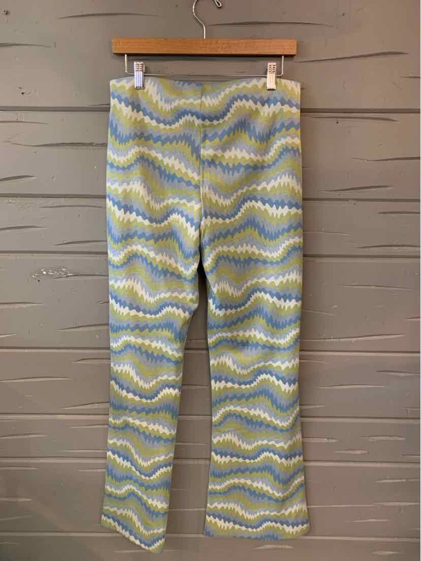 High-waisted flared pants with wavy pattern in pastel yellow, blue, and white colors.