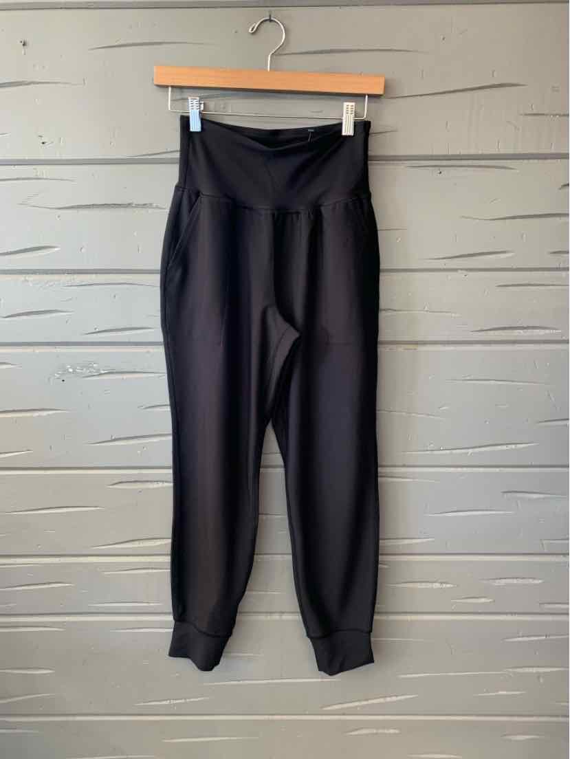Black Old Navy women's jogger pants with a high waistband, tapered legs, and elastic cuffs.
